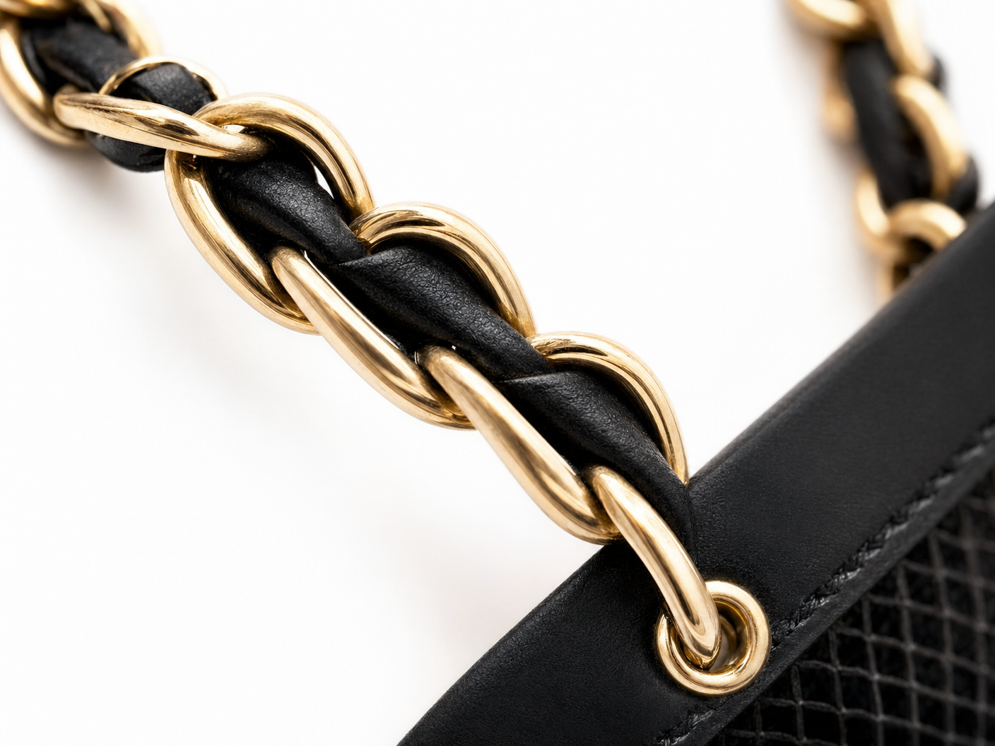 Close-up of Chanel chain link with leather weaving